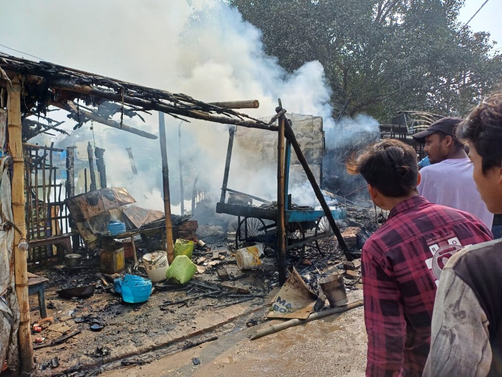 Aftermath of a gas cylinder blast in Bahadurpur, Laheriasarai, showing fire damage to nearby shops.